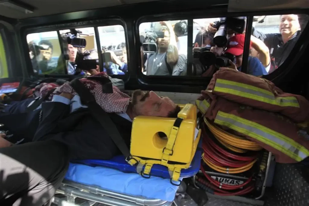 John McAfee lies on a stretcher as he is evacuated to the Policia Nacional Civil hospital in Guatemala City December 6, 2012. REUTERS